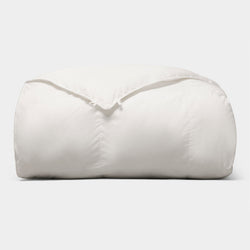 The Cozy Earth Down Alternative Comforter is neatly folded and fluffy, displayed against a plain light gray background. |Filling:Standard
