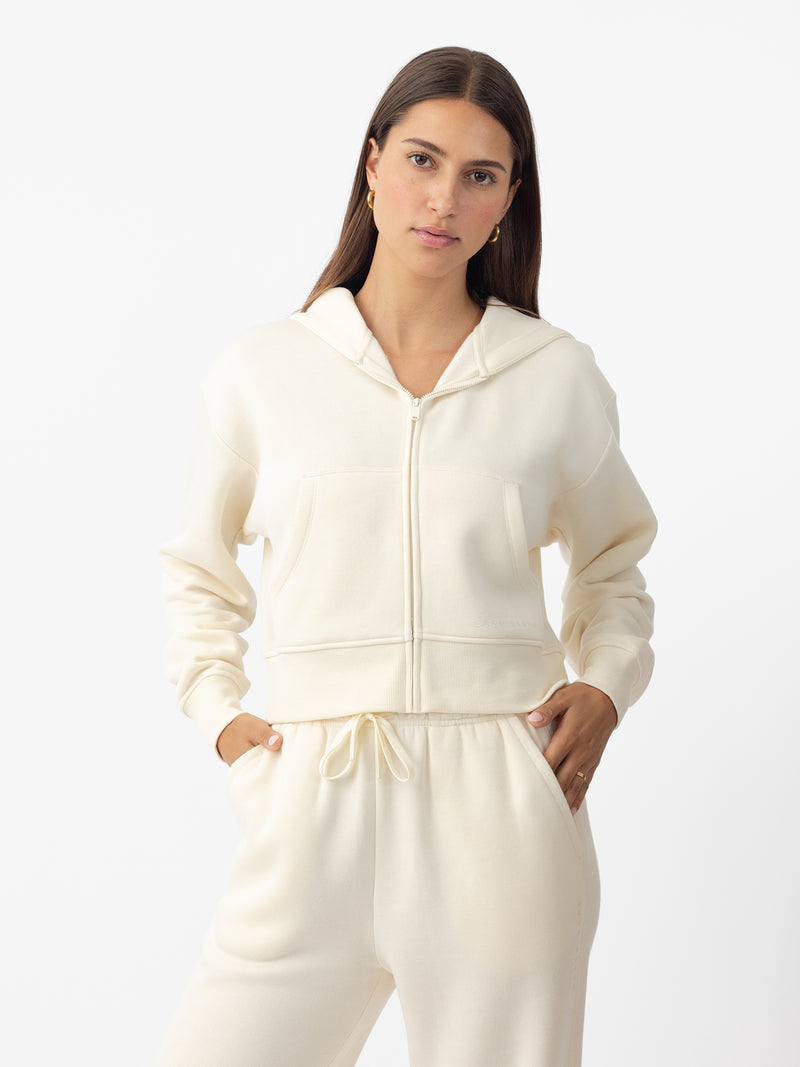 Woman wearing Alabaster CityScape Cropped Full Zip with white background