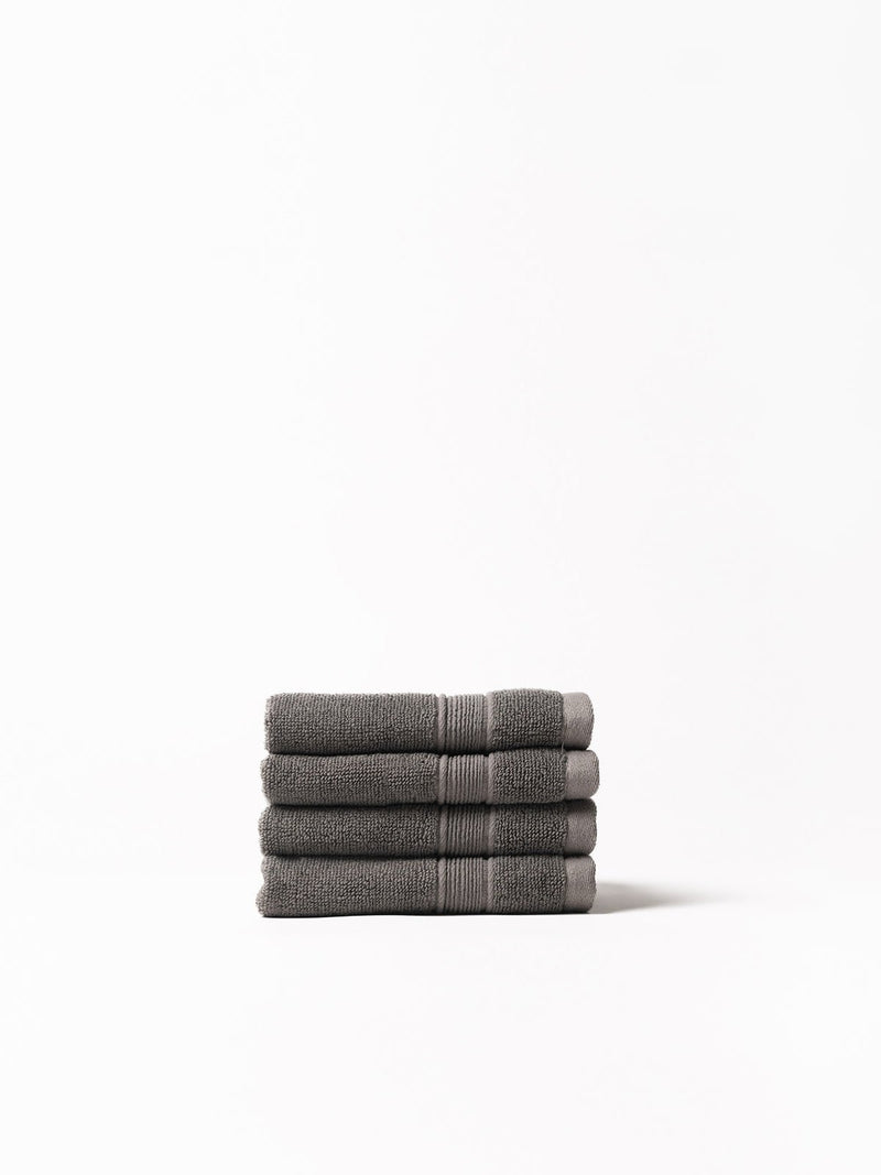 Charcoal washcloths folded with white background