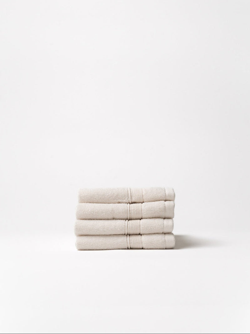 Seashell washcloths folded with white background
