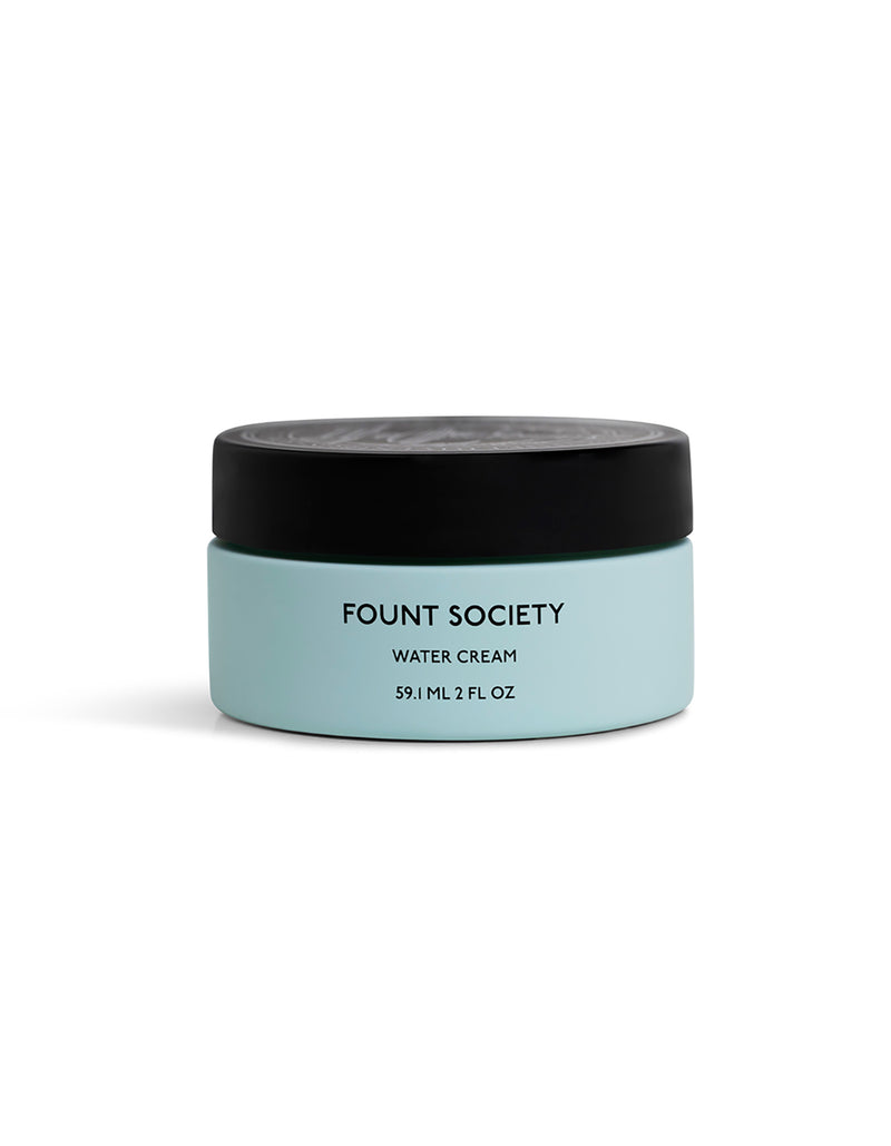 A light blue jar with a black lid labeled "Cozy Earth The Hydration Duo 59.1 ML 2 FL OZ" on a white background.