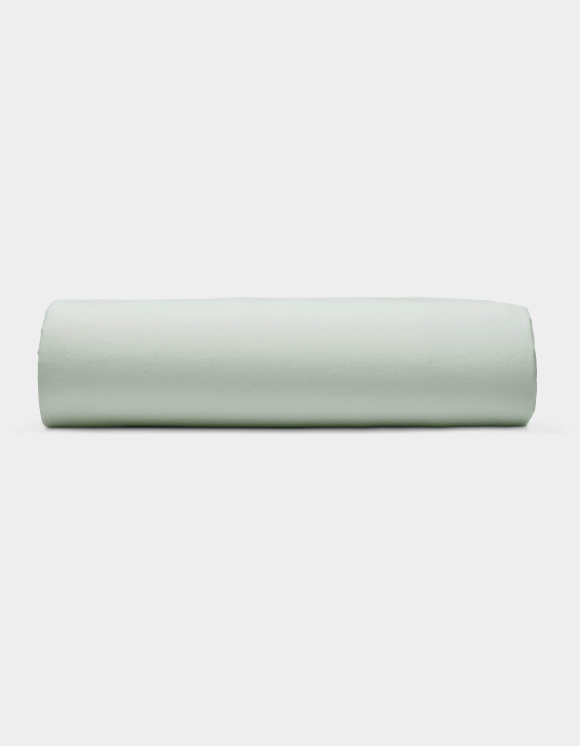 A Soft-Wash Cotton Fitted Sheet by Cozy Earth is displayed neatly folded against a plain white background.