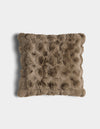 The Bubble Cuddle Pillow by Cozy Earth is a square, brown faux fur pillow with a textured, tufted surface, shown against a white background.|Color:Walnut |Size:20" x 20"