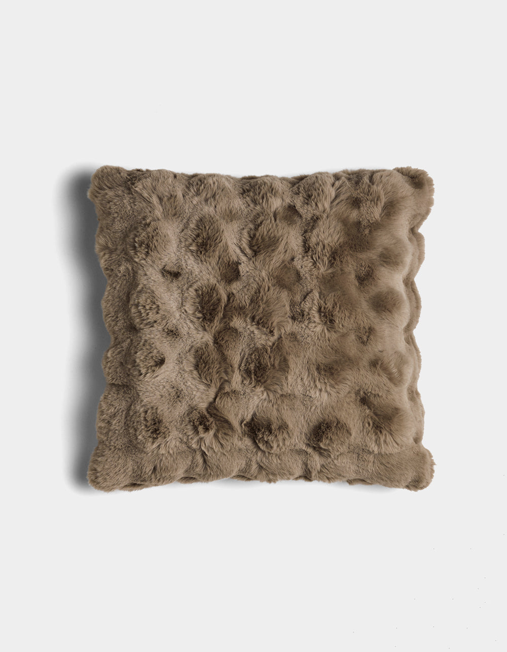 The Bubble Cuddle Pillow by Cozy Earth is a square, brown faux fur pillow with a textured, tufted surface, shown against a white background.|Color:Walnut |Size:20" x 20"