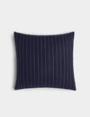 The Florence Pillow by Cozy Earth is a rectangular navy blue pillow with vertical white pinstripes, shown on a plain white background.|Color:Navy