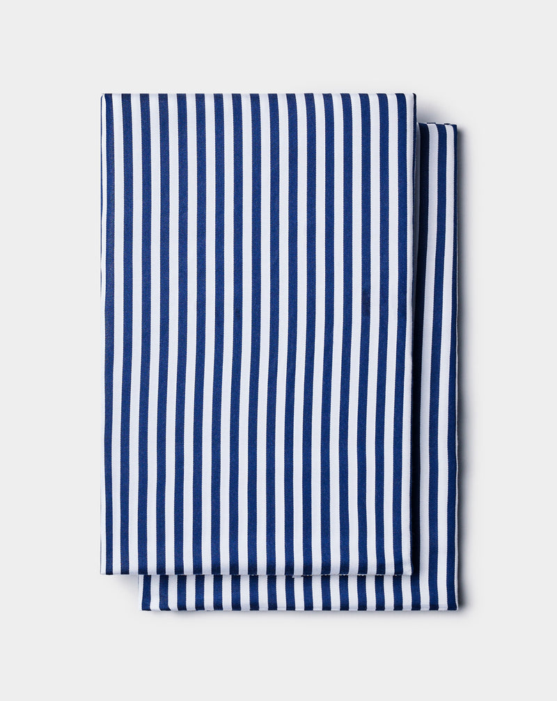 Cozy Earth Bamboo Pillowcases featuring neatly folded fabric with vertical blue and white stripes, displayed on a light gray background.