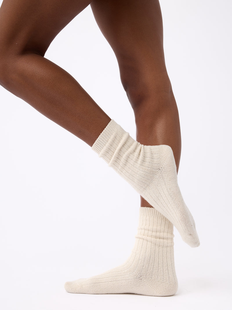Person wearing Cozy Earth Plush Lounge Calf Sock 1-Pack in Alabaster