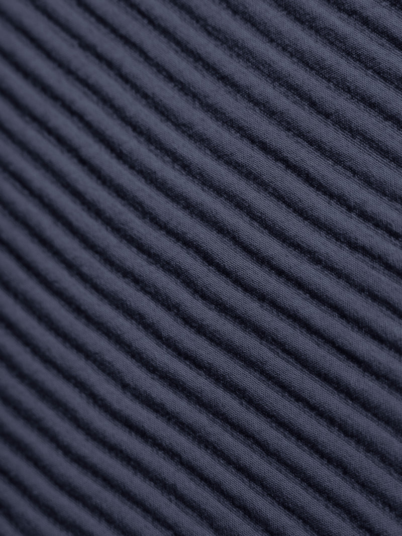 Close up of navy coverlet fabric