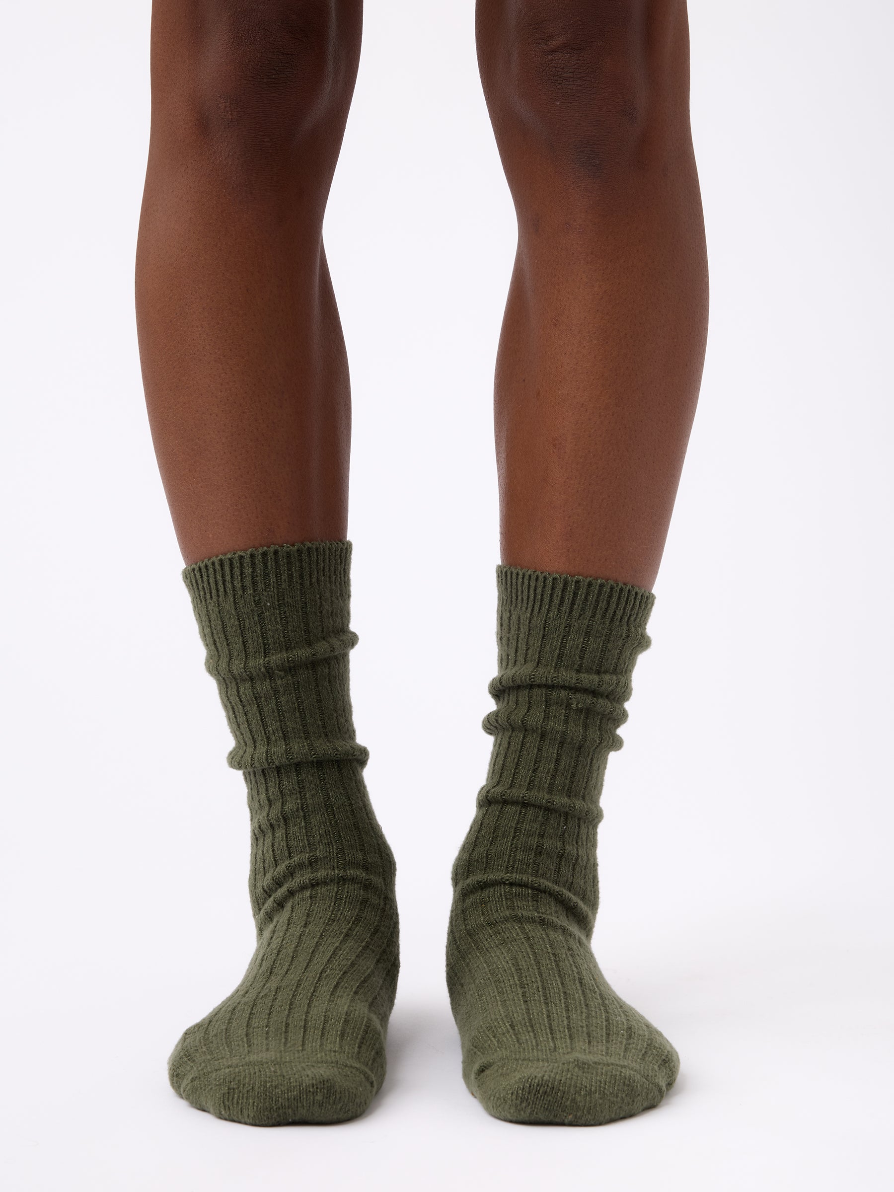 Person wearing Cozy Earth Plush Lounge Calf Sock 1-Pack in Olive 