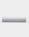 A Bamboo Fitted Sheet by Cozy Earth, featuring a light gray and white horizontal striped pattern, photographed on a plain white background.|Color:Classic Stripe in Dew