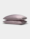 Two Cozy Earth Bamboo Pillowcases are stacked neatly on top of each other against a plain white background.|Color:Lavender