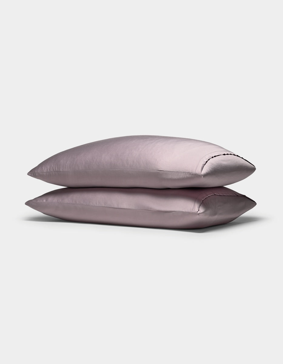 Two Cozy Earth Bamboo Pillowcases are stacked neatly on top of each other against a plain white background.|Color:Lavender