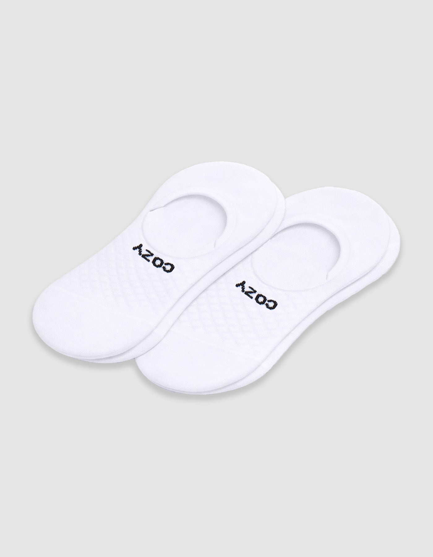 Women's Essential No-Show Sock by Cozy Earth: white socks with a quilted pattern and "COZY" in black near the opening, shown on a plain white background.