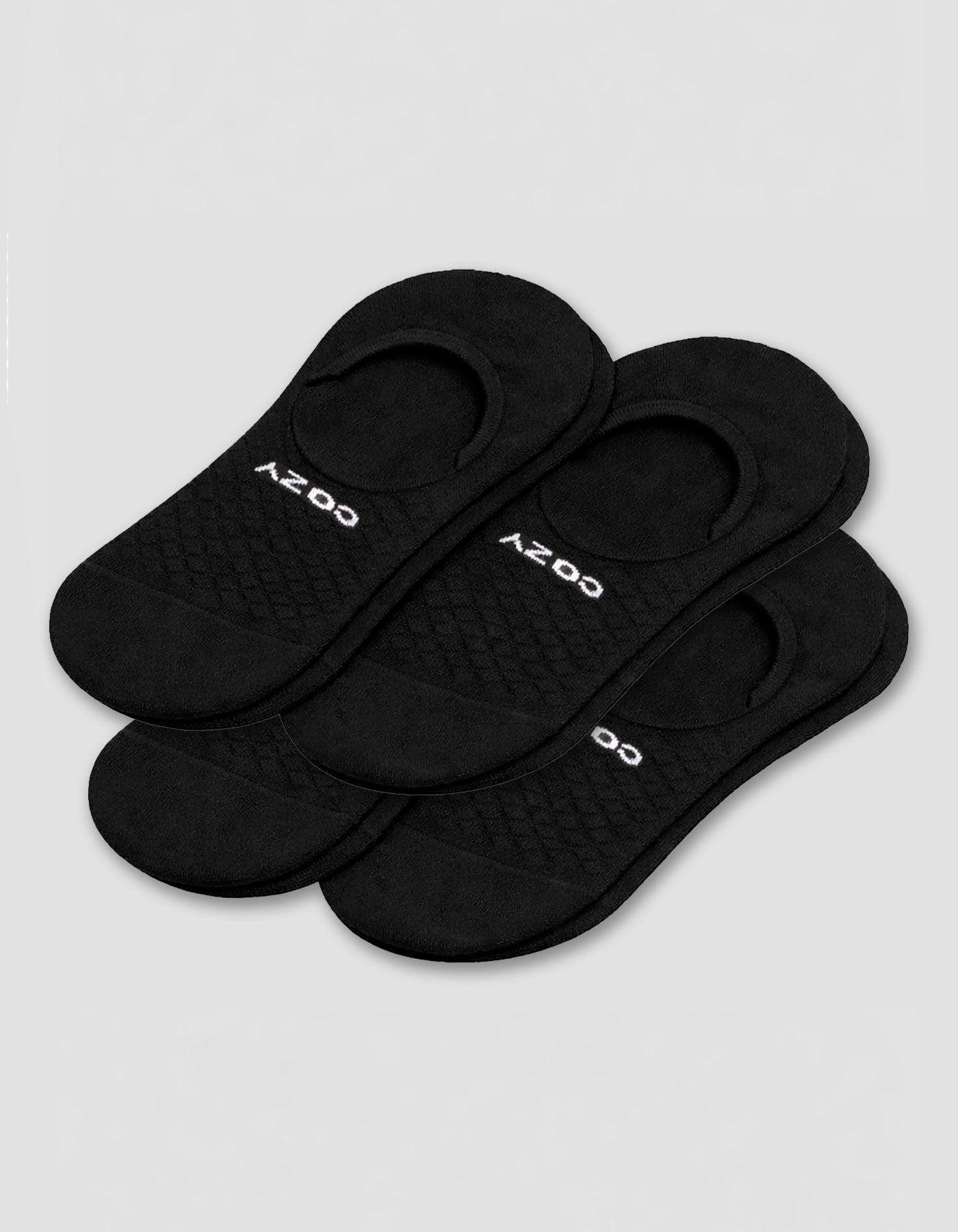 A 4-pack of black Men's Essential No-Show Socks by Cozy Earth, each pair featuring "COZY" in white, displayed on a plain white background.|Color:Black