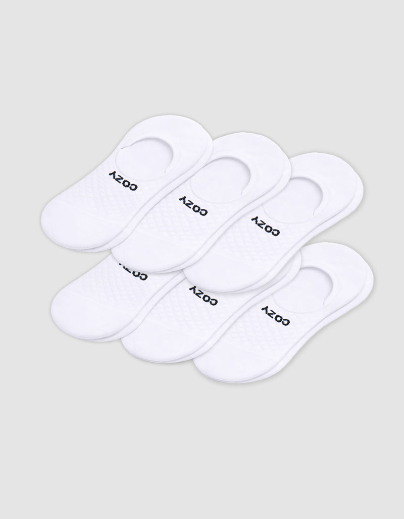 Six pairs of Cozy Earth Men's Essential No-Show Socks are stacked on a plain white background, each featuring "COZY" printed in black near the heel opening.