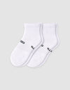 The Cozy Earth Men's Essential Quarter Sock features white ribbed cuffs and a discreet black text design on the sides, displayed against a plain light background.|Color:White