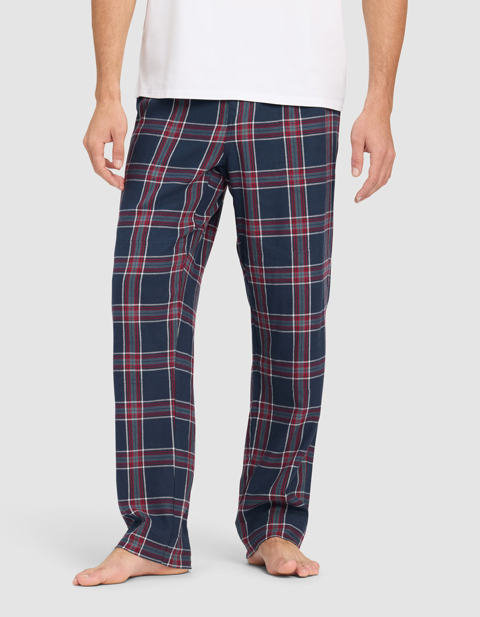 Plaid Cozy Earth Farmhouse Pajama Pants worn by a man on a white background
