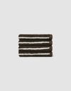 The Cozy Earth Striped Luxe Bath Towel Set features three neatly folded dark brown towels with white stripes, stacked on a light gray background.|Color:Espresso Coconut Stripe