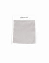 A gray Soft-Wash Cotton Sheet swatch with zigzag edges is attached to a white card labeled "Cozy Earth" at the top, displayed on a plain white background.