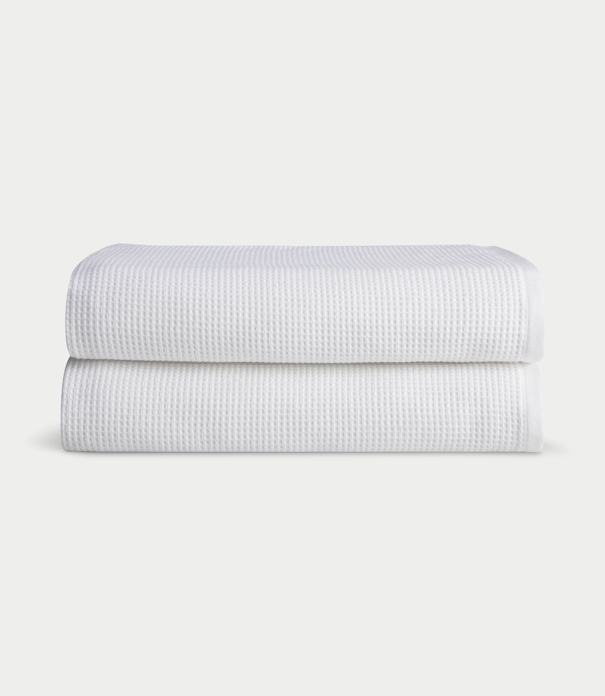 Waffle Bath Sheets in the color White. Photo of Waffle Bath Sheets taken with white a background. 