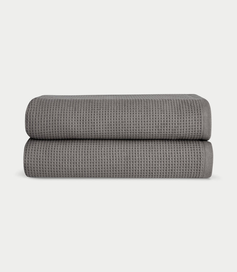 Waffle Bath towels in the color charcoal. Photo of Charcoal Waffle Bath towels taken with white background.
