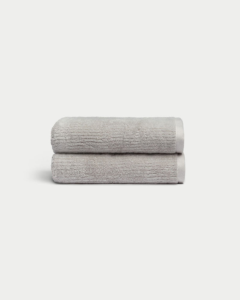 Ribbed Terry Hand Towels in the color Light Grey. Photo of product taken with a white background.