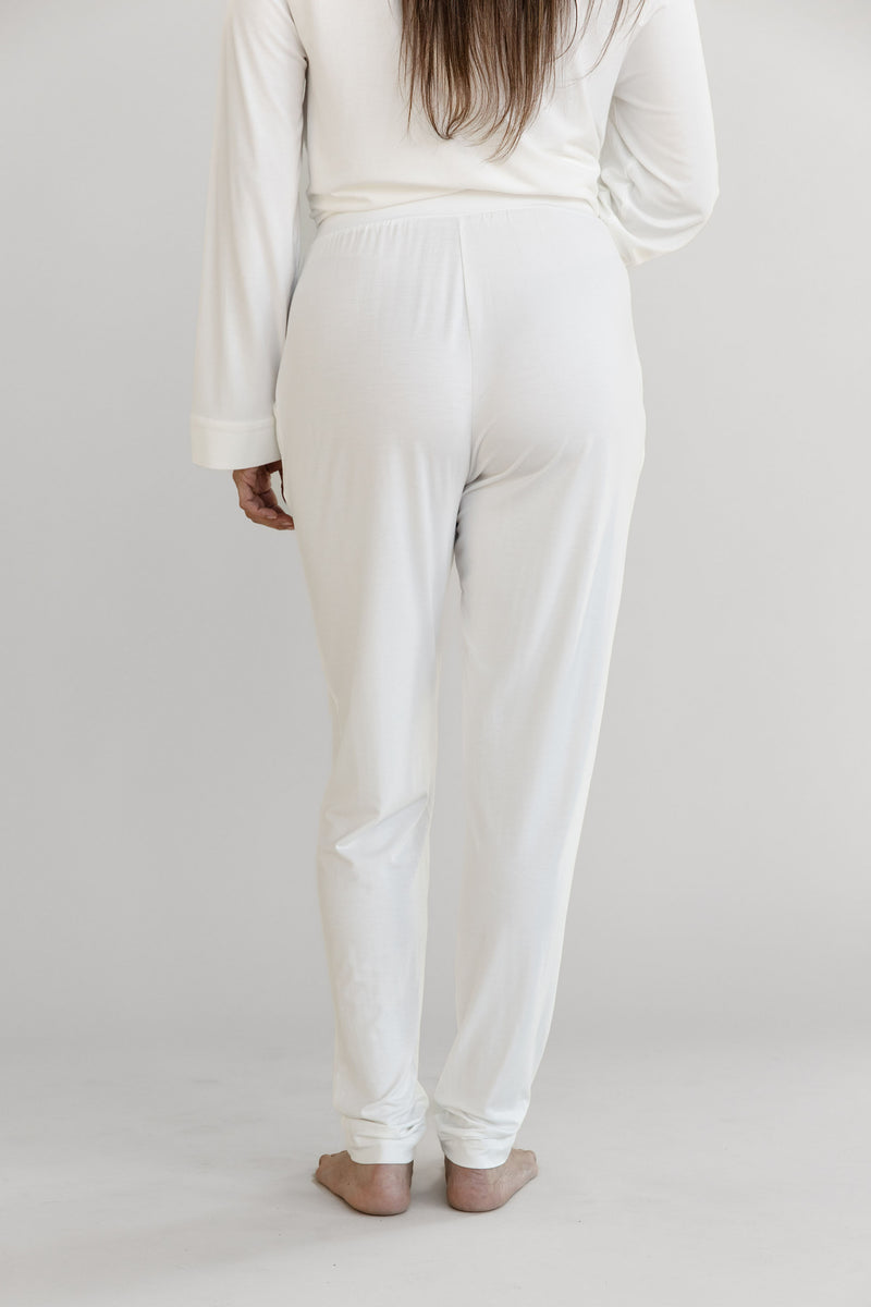 Gray Cozy Earth Stretch Knit Tapered Pant set worn by a person on a light gray background. They face backwards