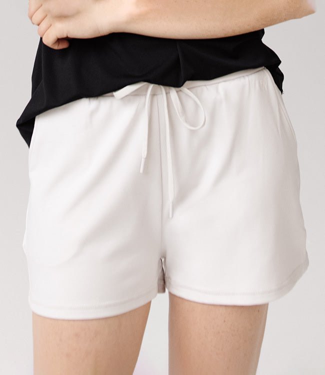 Person wearing Cozy Earth Brushed Bamboo Jogger Shorts in white and a black top |Color:Ivory