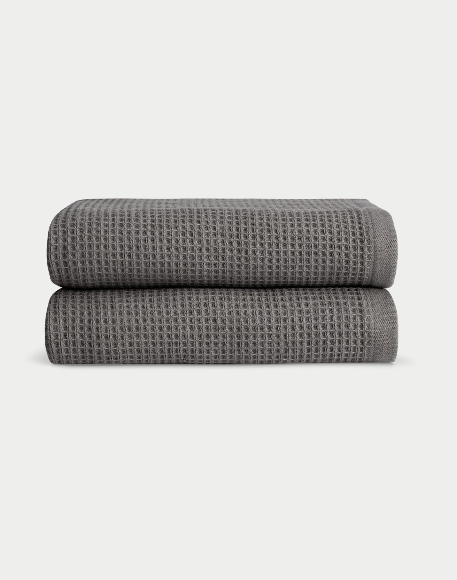 Charcoal Waffle Hand Towel set neatly folded. The photo was taken with a white background. 