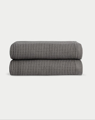 Charcoal Waffle Hand Towel set neatly folded. The photo was taken with a white background. |Color:Charcoal